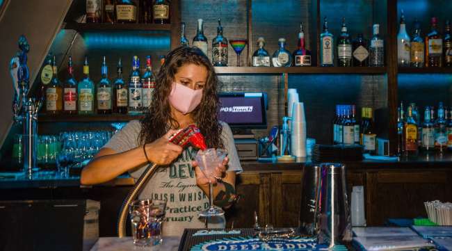A bartender makes a drink at a nightclub in Columbia, S.C.