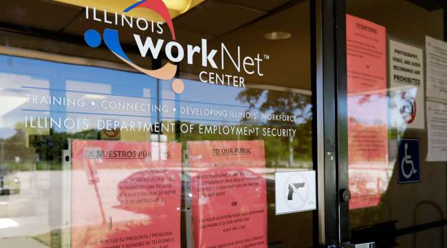 Information signs are displayed at a closed Illinois work center on June 11.