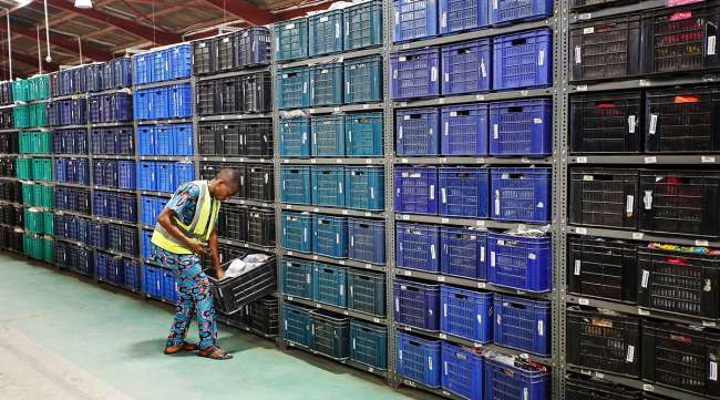 A worker scans inventory inside a Jumia Technologies AG distribution warehouse in Lagos, Nigeria.