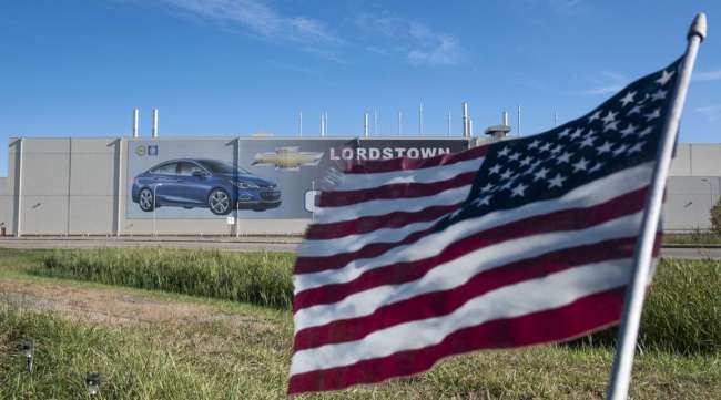 An American flag flies in front of the closed GM plant in Lordstown, Ohio, in 2019.