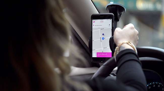 A Lyft driver with map visible on phone