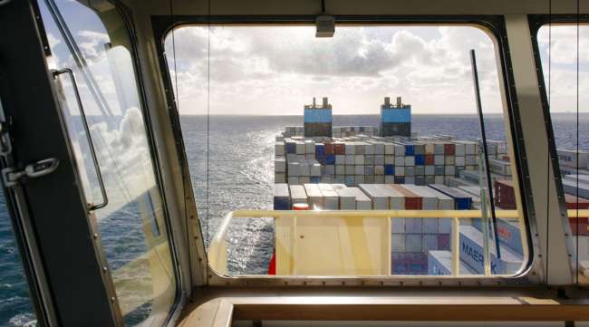 Shipping containers sit aboard a Maersk container ship. (Kristian Helgesen/Bloomberg News)