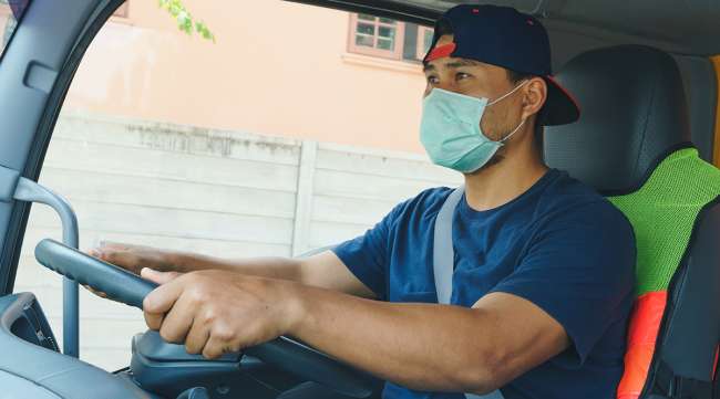 Truck driver wearing face mask