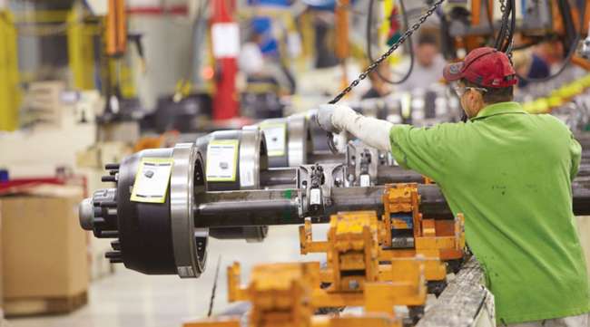 Meritor worker on trailer axle assembly line