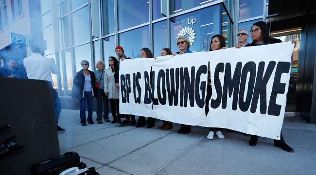 Activists demonstrate outside BP headquarters in Denver on Nov. 14, 2018
