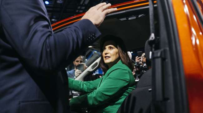 Michigan Gov. Gretchen Whitmer sits in a Ford Ranger pickup truck during the North American International Auto Show in Detroit in 2019.