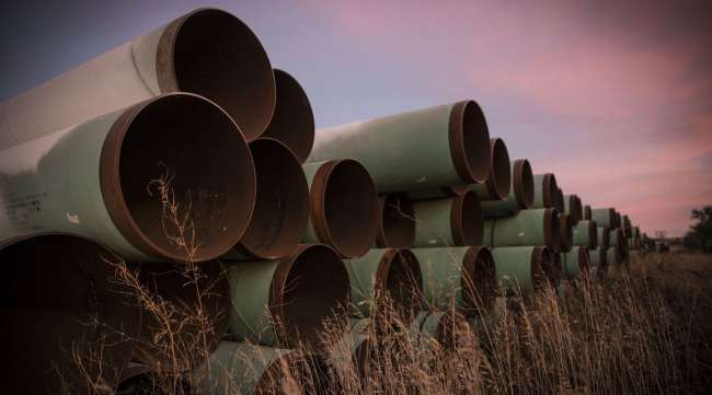 Miles of unused pipe, prepared for the Keystone XL pipeline, sit in a lot outside Gascoyne, N.D. in October 2014.