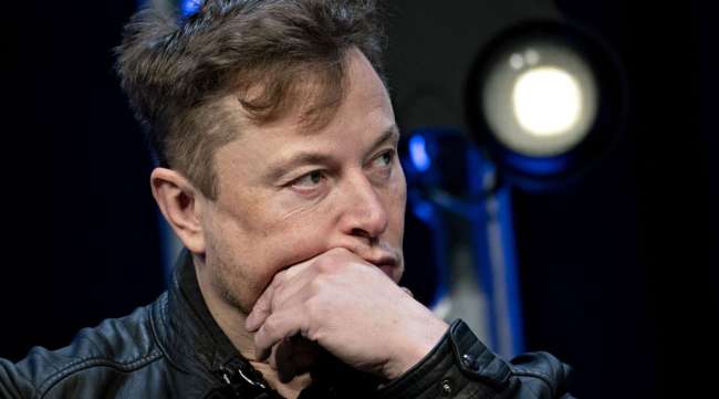 Elon Musk listens during a discussion at the Satellite 2020 Conference in Washington on March 9.
