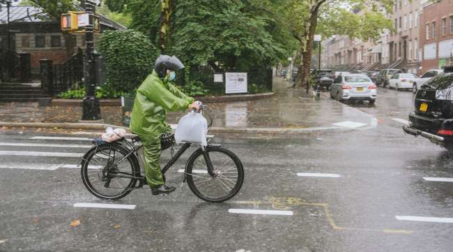 A delivery rider during tropical storm Henri in Brooklyn