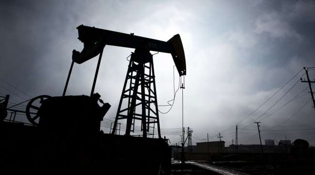 A pumpjack is silhouetted as it operates in Azerbaijan.