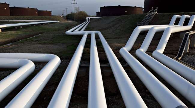 Pipelines run near oil storage tanks in Cushing, Okla.