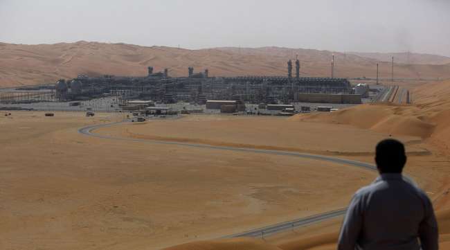 An employee looks out over a Saudi Aramco facility in Saudi Arabia.