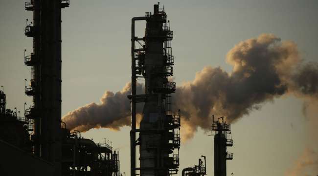 Emissions rise from an oil refinery in Louisiana on June 12.