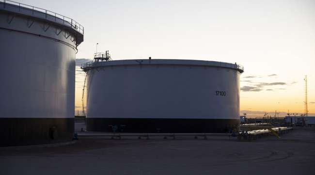 Crude oil storage tanks stand outside Midland, Texas.