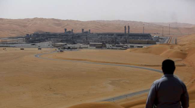An employee looks out over a facility in Saudi Aramco's oilfield in Shaybah, Saudi Arabia.