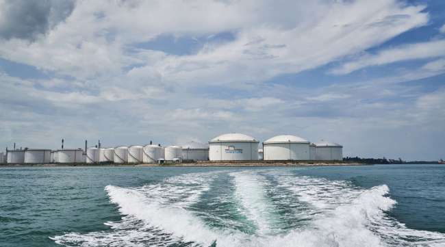 Oil refineries and storage tanks are seen from a boat off the coast of Singapore on May 25.