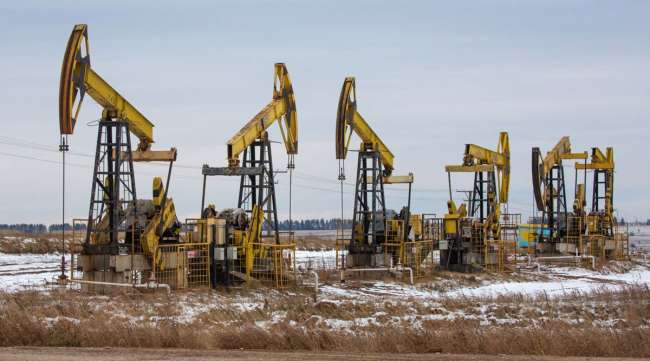 Oil pumping jacks operate in a Russian oilfield in November 2020. (Andrey Rudakov/Bloomberg News)