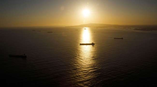 Oil tankers are seen anchored in the Pacific Ocean near Long Beach, Calif.