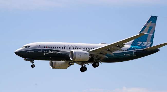 A Boeing 737 Max jet heads to a landing following a test flight in Seattle on June 29.