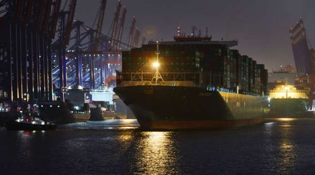 Container ship Taurus, operated by Evergreen Marine Corp., sits with cargo at the Port of Hamburg in Germany on Nov. 10.