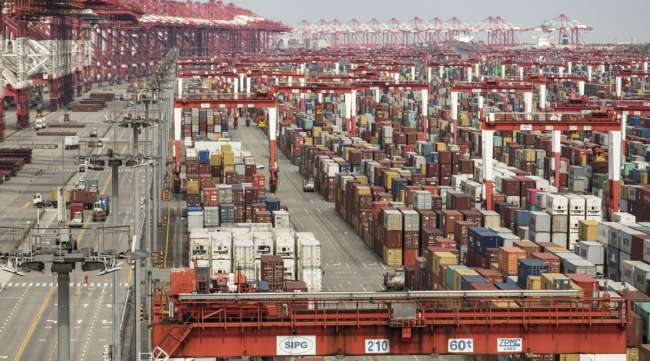 Shipping containers stacked at the Yangshan Deepwater Port in Shanghai, China, on March 23.