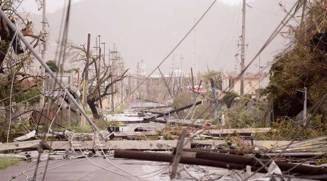 Smashed poles and snarled power lines brought down by Hurricane Maria in Puerto Rico