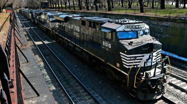 A Norfolk Southern freight train rolls through downtown Pittsburgh. (Gene J. Puskar/Associated Press)