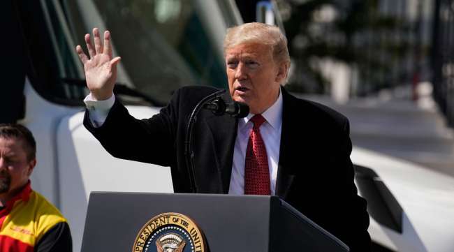 President Trump waves during an event celebrating American truckers at the White House on April 16.