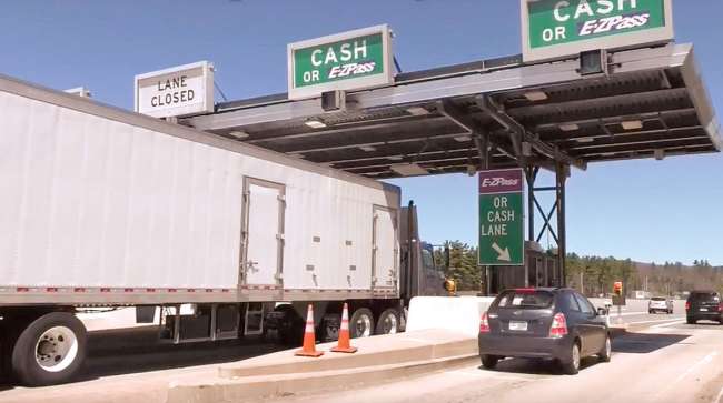 Truck going through tollbooth