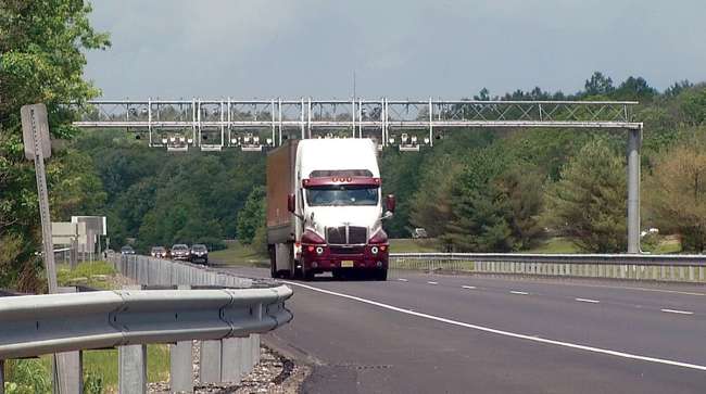 Truck passes under Rhode Island toll gantry