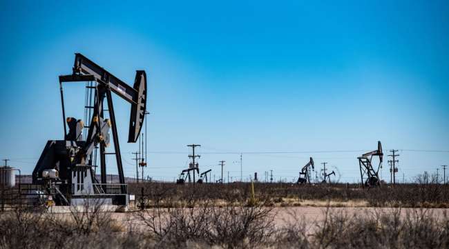 Oil pumpjacks stand outside Odessa, Texas.