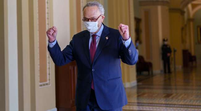 Senate Majority Leader Chuck Schumer (D-N.Y.) celebrates after the Senate narrowly passed the $1.9 trillion relief bill