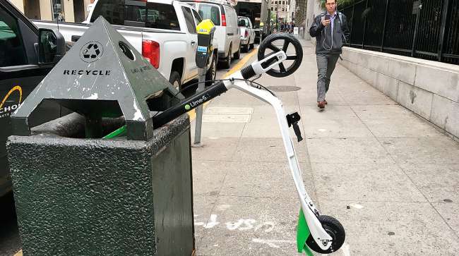 Scooter in trash in San Francisco