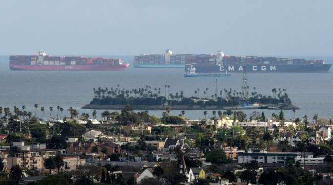 Containerships wait offshore at the Port of Long Beach in California on March 25.