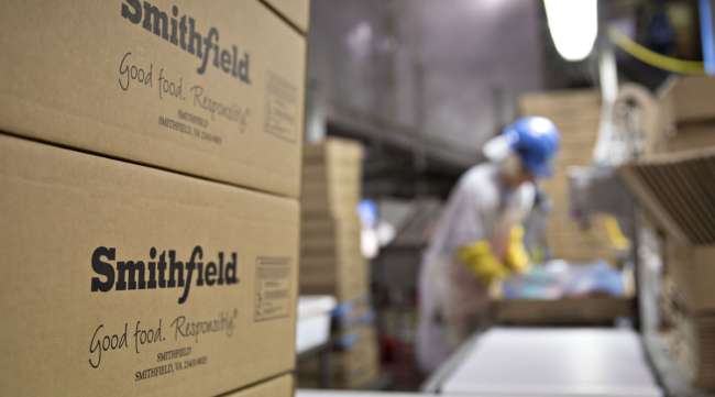 The Smithfield Foods logo is displayed on boxes at the company's processing facility in Missouri.