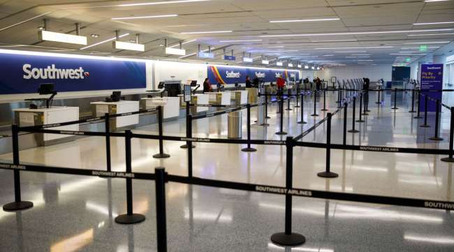 A Southwest Airlines check-in area at a nearly empty terminal in LAX.