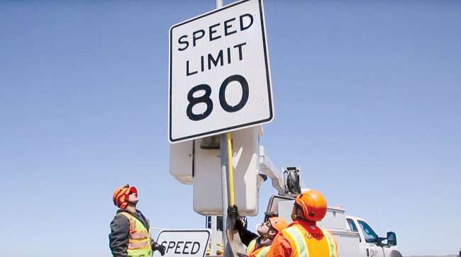 Workers install 80 mph speed limit sign in Nevada