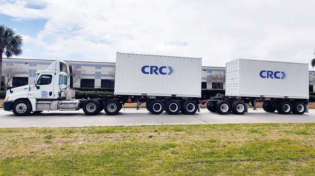 CRC Global Solutions trucks carry two 20-foot containers in tandem