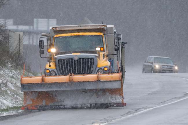 A snow plow works Interstate 79 in Zelienople, Pa.