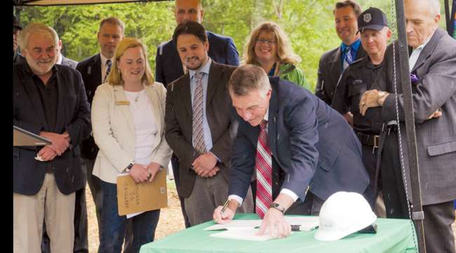 Vermont Gov. Phil Scott signs bill
