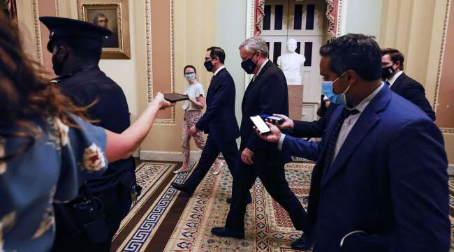 Steven Mnuchin and Mark Meadows leave after speaking to reporters.