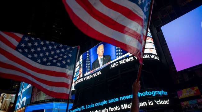 News that Joe Biden is projected winner of the U.S. presidency shows on a screen in New York on Nov. 7.