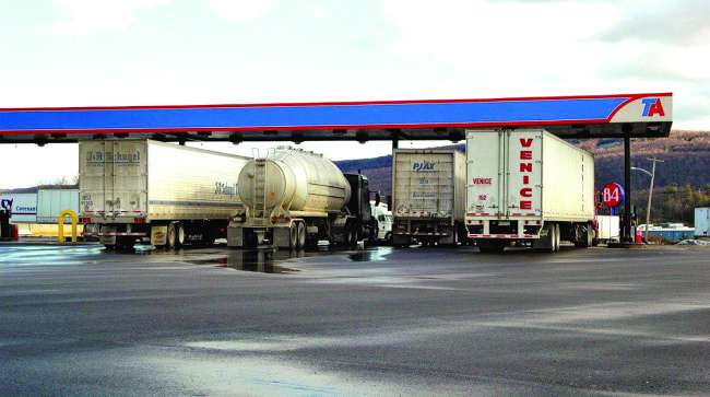 Trucks refuel at a TravelCenters of America stop