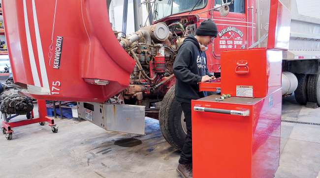 Tooele Tech student works on truck