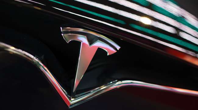 The Tesla logo is seen on the grille of a Model X vehicle in Moscow, Russia, in July 2018.