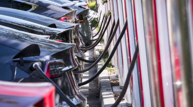 Tesla vehicles stand at a Tesla Surpercharger station in California in October 2019.