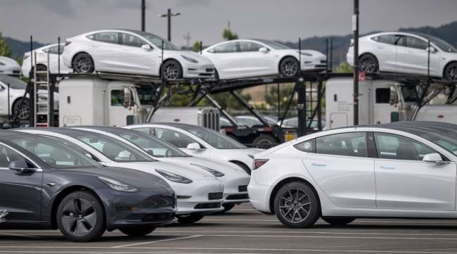 Tesla vehicles are parked at the company's assembly plant in Fremont, Calif., on May 11.