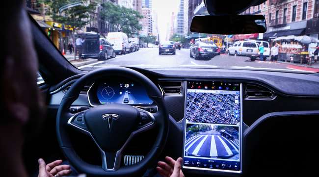 Tesla car with autopolit engaged