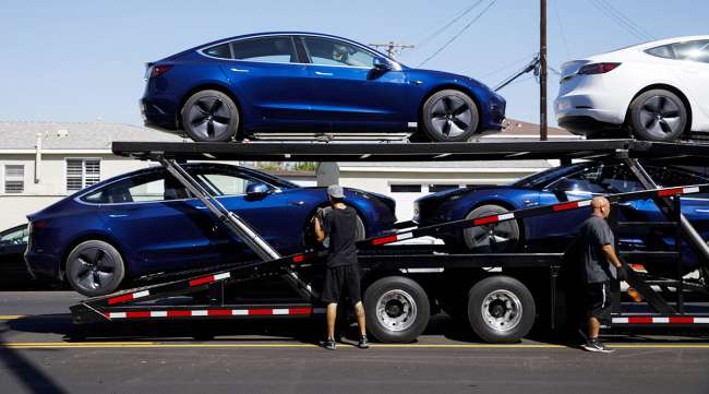 Tesla cars on trailer