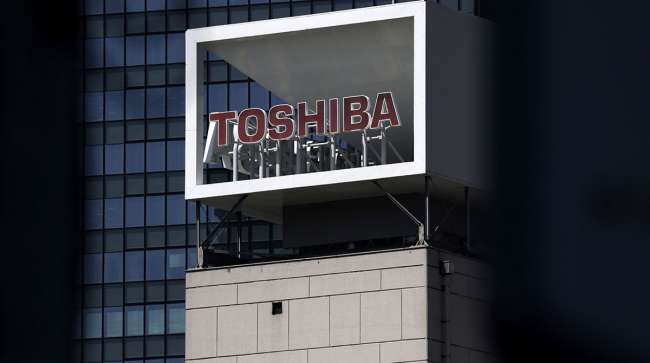Signage for Toshiba Corp. displayed at the company's headquarters in Tokyo, Japan